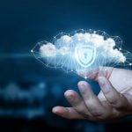Hand shows a data cloud with a protective shield.