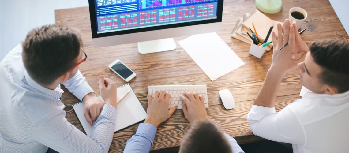 Young men working in office
